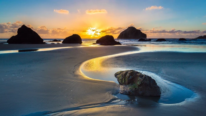 sunset rock beach sea water land sky scenics nature 2k
