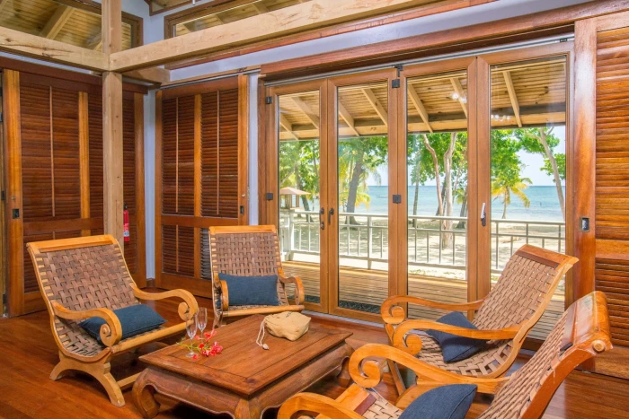 brown wooden 5 piece living room furniture set window view beach 2k