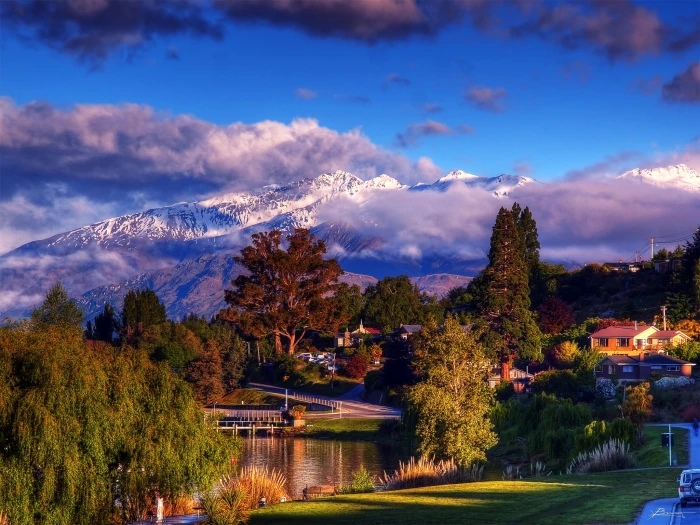 village house beside body of water near snow covered mountain wanaka 2k