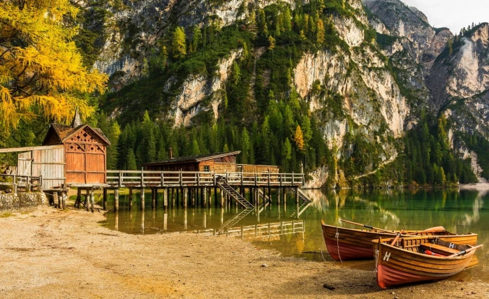 boat dock lake mountains beach forest cliff Alps trees 2k