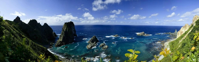 body of water near mountain under blue sky multiple display 2k 4k