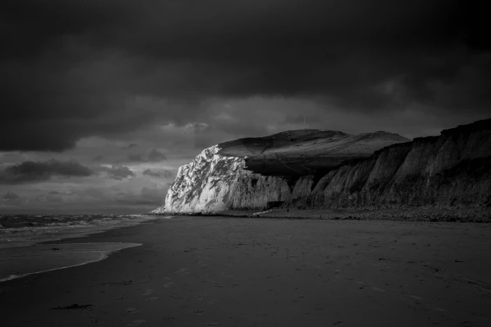Mountain Near Beach Shore Under Dark Cloudy Sky black and white 2k 4k 5k