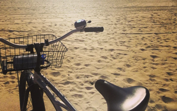 sand beach bicycle land nature day vehicle transportation 2k