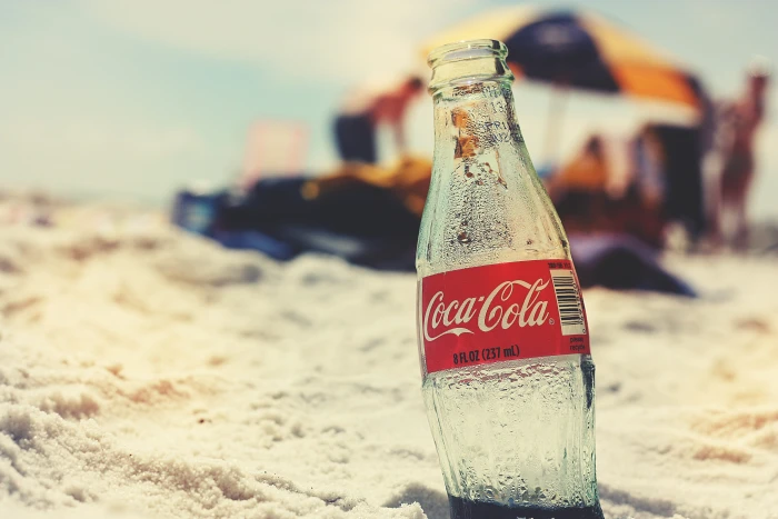 Coca Cola glass bottle on seashore coca cola beach retro vintage 2k 4k