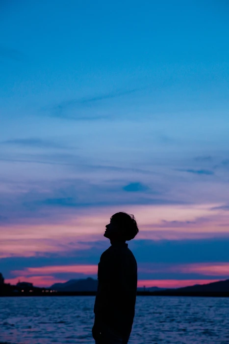 silhouette of person boy sunset sky sea nature people dusk 2k