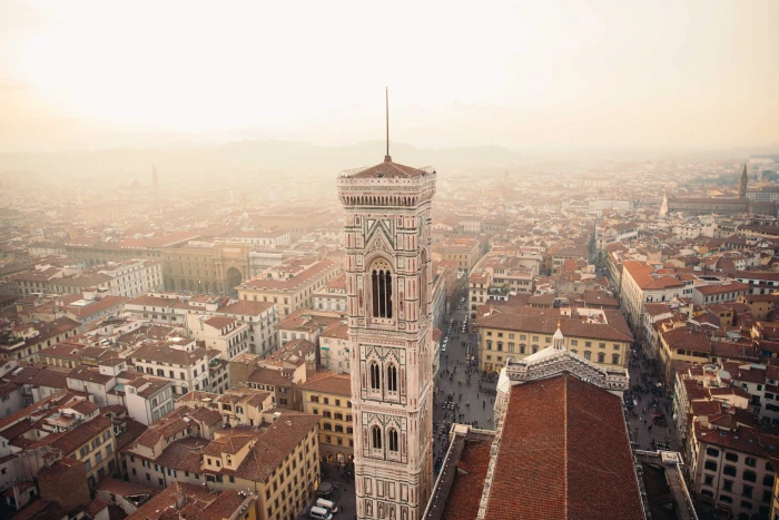 Towers in Florence Italy surrounded by clay rooftops of residences 2k