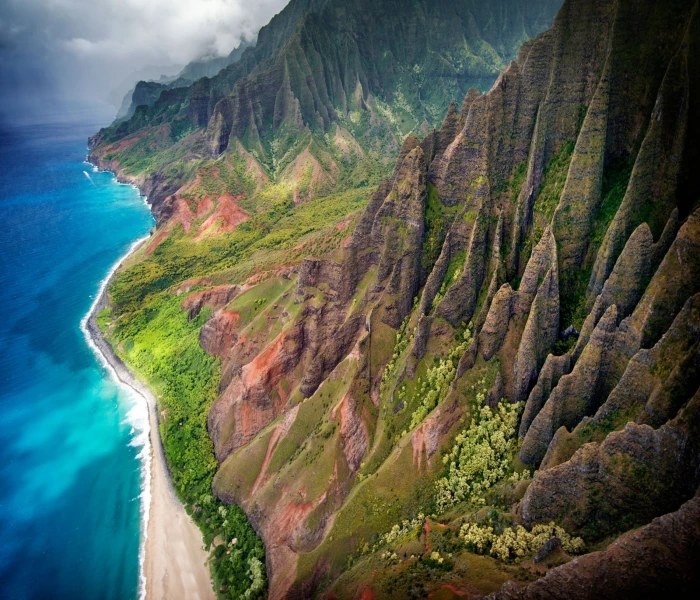 aerial view of mountains and body water Kauai tropical beach 2k