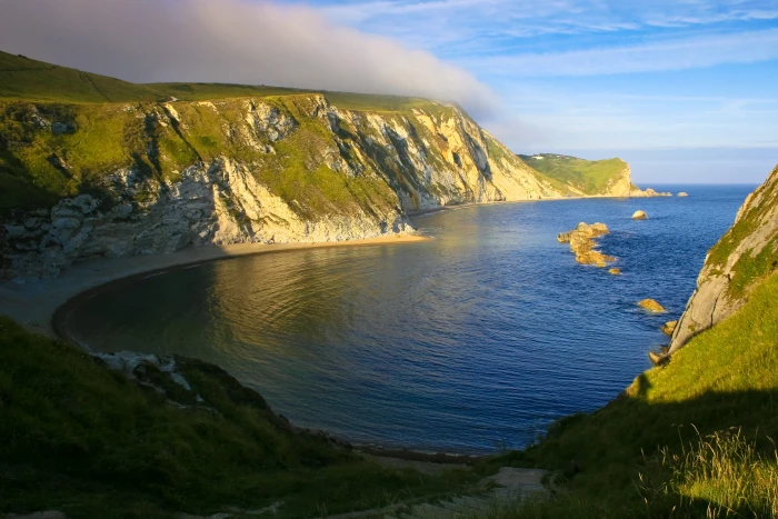 green and brown mountain jurassic coast devon 2k
