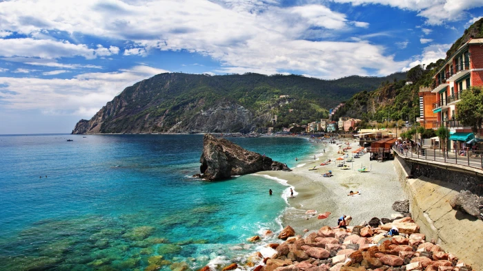 Italy Monterosso Cinque Terre beach coast sea rocks houses mountains green mountain with ocean resort 2k