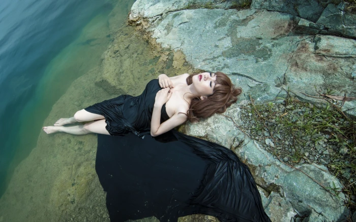 women on beach Asian brunette in water black clothing 2k