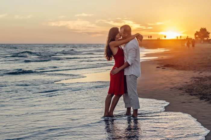 Couple Kissing on Beach during Golden Hour dawn girl in love 2k 4k 5k