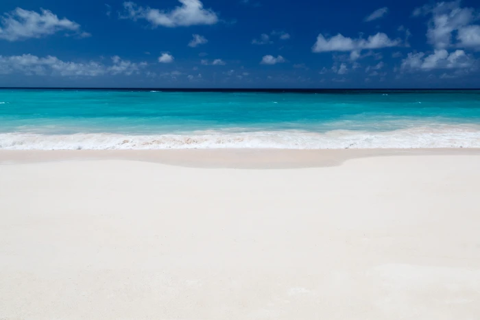 white sand beach and blue water background clear cloud coastline 2k 4k 5k