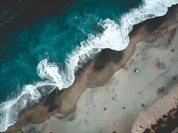 aerial photography of tidal wave and sand beach shore coast 2k 4k