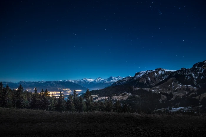 mountain range under blue sky night mountains city snow landscape 2k 4k 5k