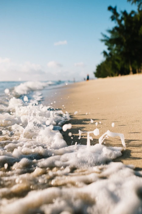 closeup photo of ocean beach side waves sea sand foam splash 2k 4k