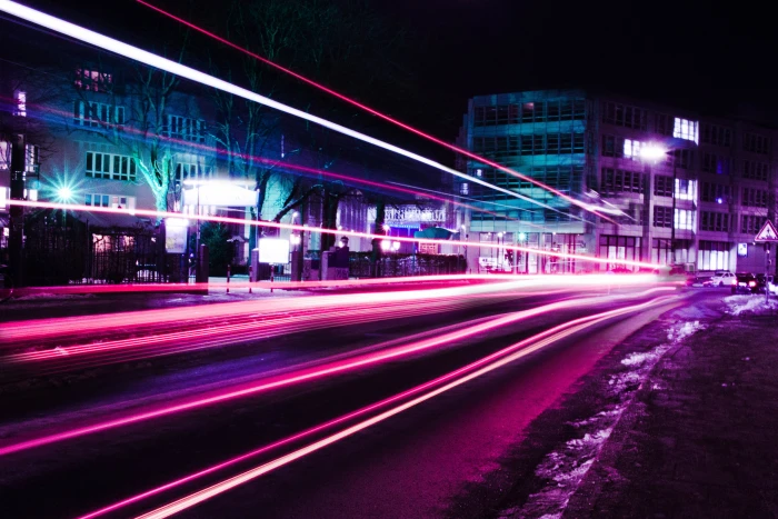 timelapse photography of pink vehicle lights near buildings speed light 2k 4k 5k