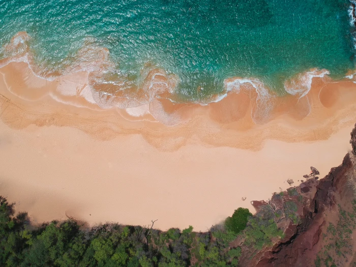 aerial view of seashore beach coast topdown sand green water 2k 4k