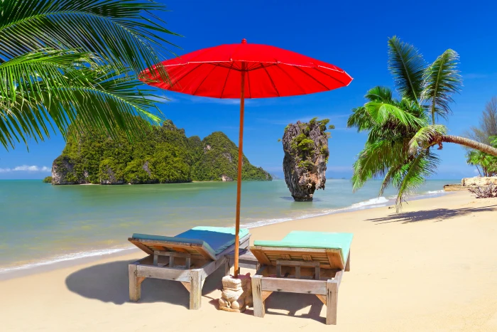red parasol and two teal sun lounger chairs sand sea beach 2k 4k