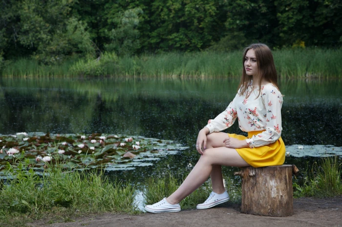 woman in white floral long sleeved shirt and yellow mini skirt 2k 4k 5k