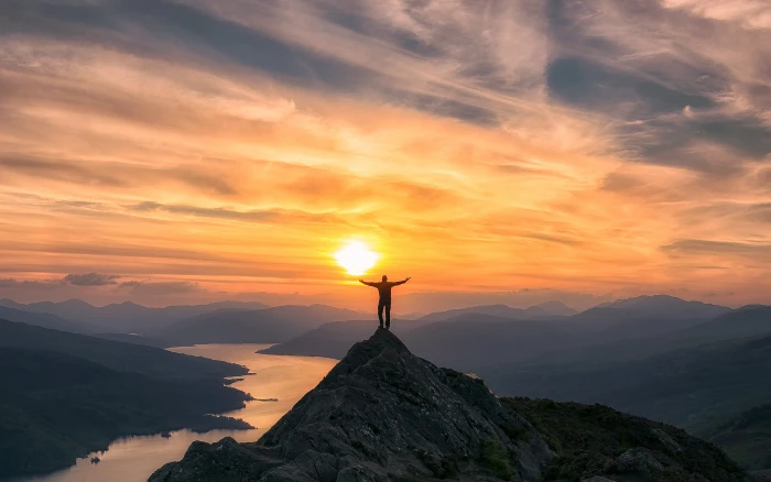 photo of man on top mountain during sunset Trossachs Scotland 2k 4k 5k