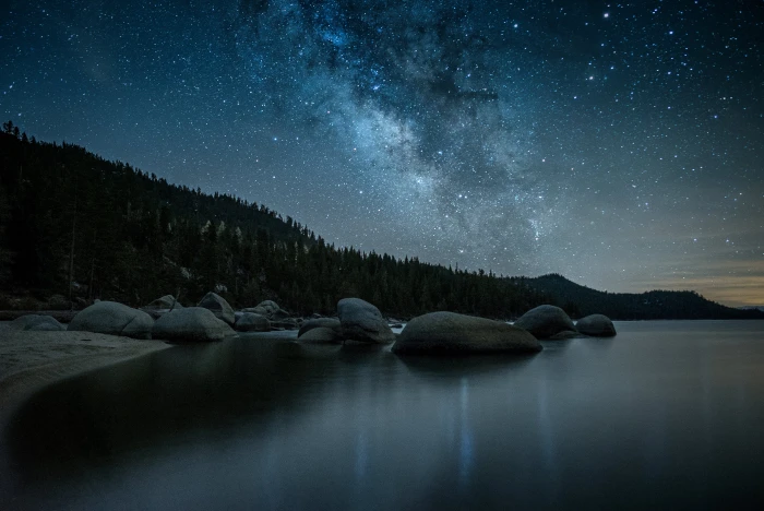 photo of stars over body water during nighttime nevada lake tahoe 2k 4k