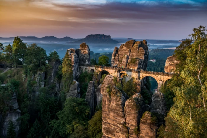 brown concrete bridge near rock monolith landmark Bastei Saxon Switzerland 2k 4k 5k