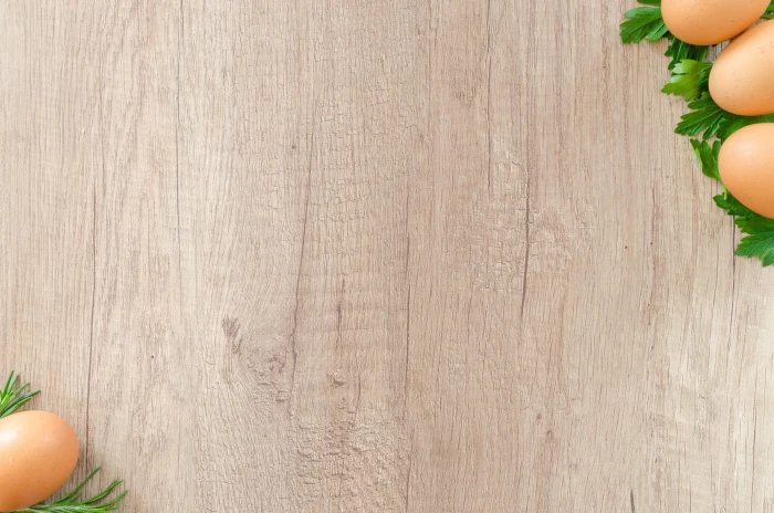 brown eggs on top of green leaf vegetables wooden surface 2k 4k 5k