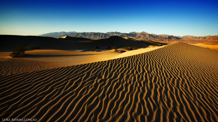 sand dunes under cloudy blue sky during daytime Death Valley 2k 4k 5k