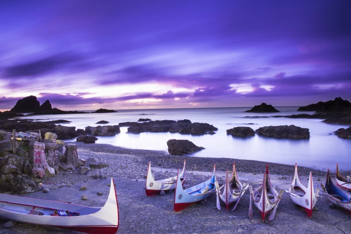 seven boats on seashore under purple clouds blue sky ponso 2k 4k 5k