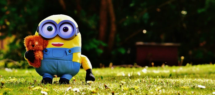 macro photography of minion on grassfield funny figure cute 2k 4k 5k