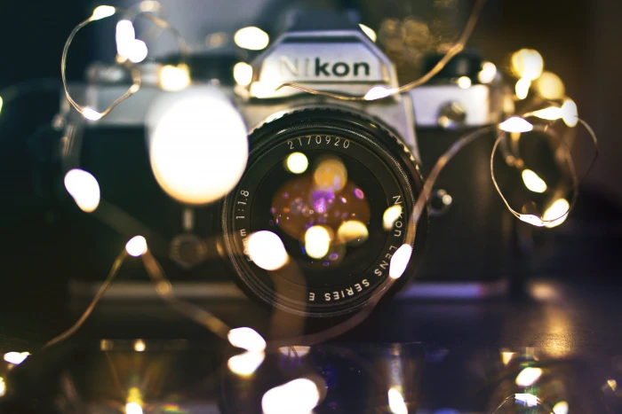 bokeh photography of Nikon DSLR camera black 2k 4k 5k