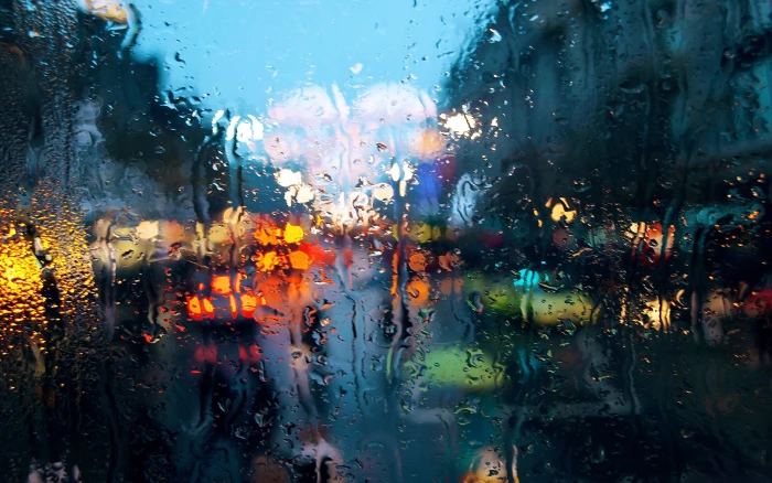 clear glass panel rain cityscape water on bokeh abstract 2k