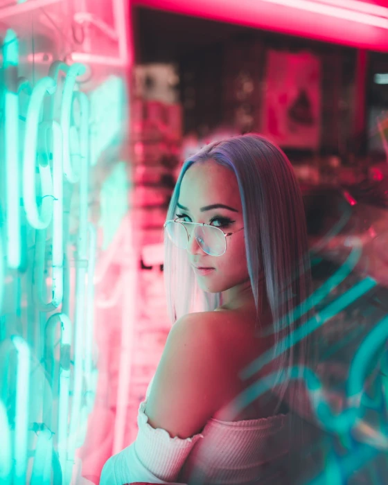 women model looking at viewer portrait sunglasses dyed hair