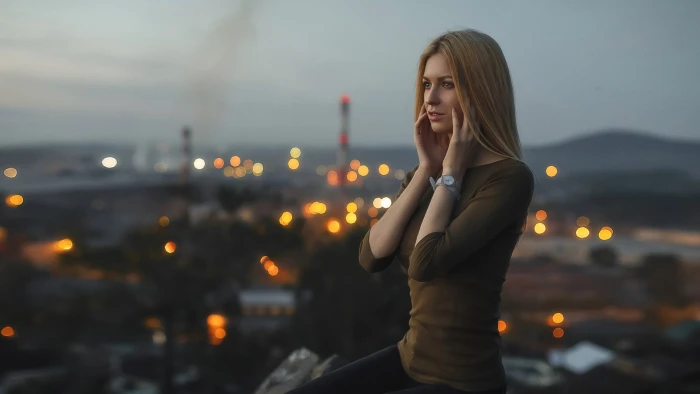 women s brown 3 4 sleeved shirt woman with long on top of building during night time 2k