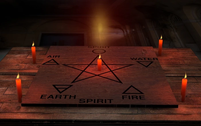 six element and star draw on board beside four candles space 2k
