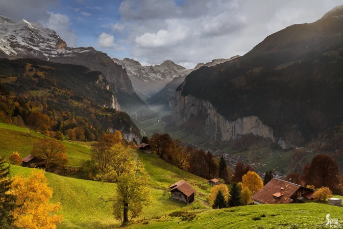 aerial photo of a mountain and houses lauterbrunnen 2k 4k 5k