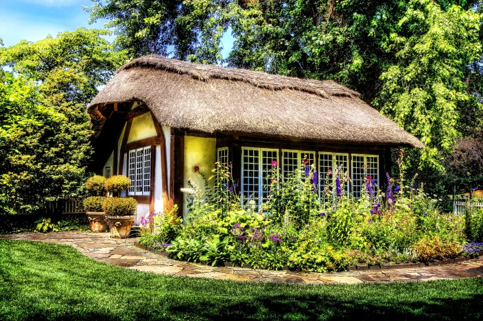 white and brown house surrounding plants trees at daytime 2k 4k
