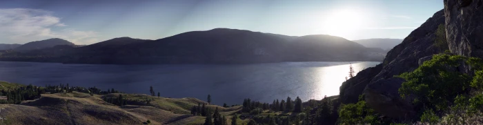 calm body of water surrounded with mountains at daytime Landscape 2k 4k 5k 8k 10k 16k