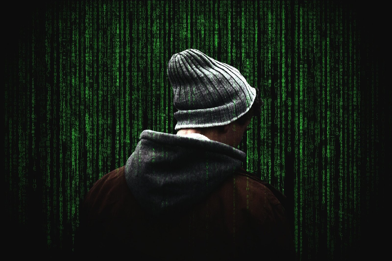 man standing near green wall cyber security cybersecurity computer 2k
