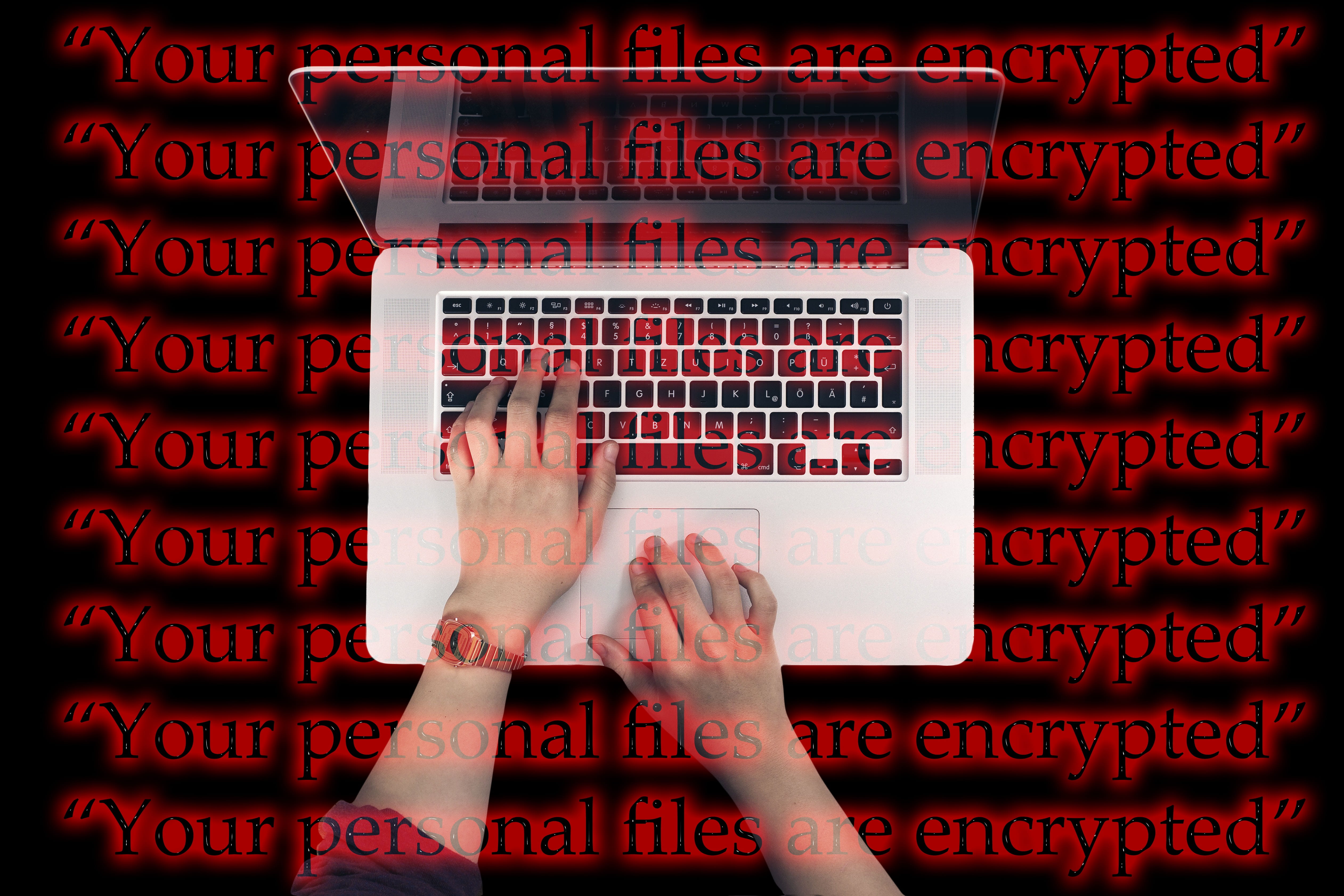 person using MacBook Pro Laptop Keyboard Cyber Attack wannacry 2k 4k 5k