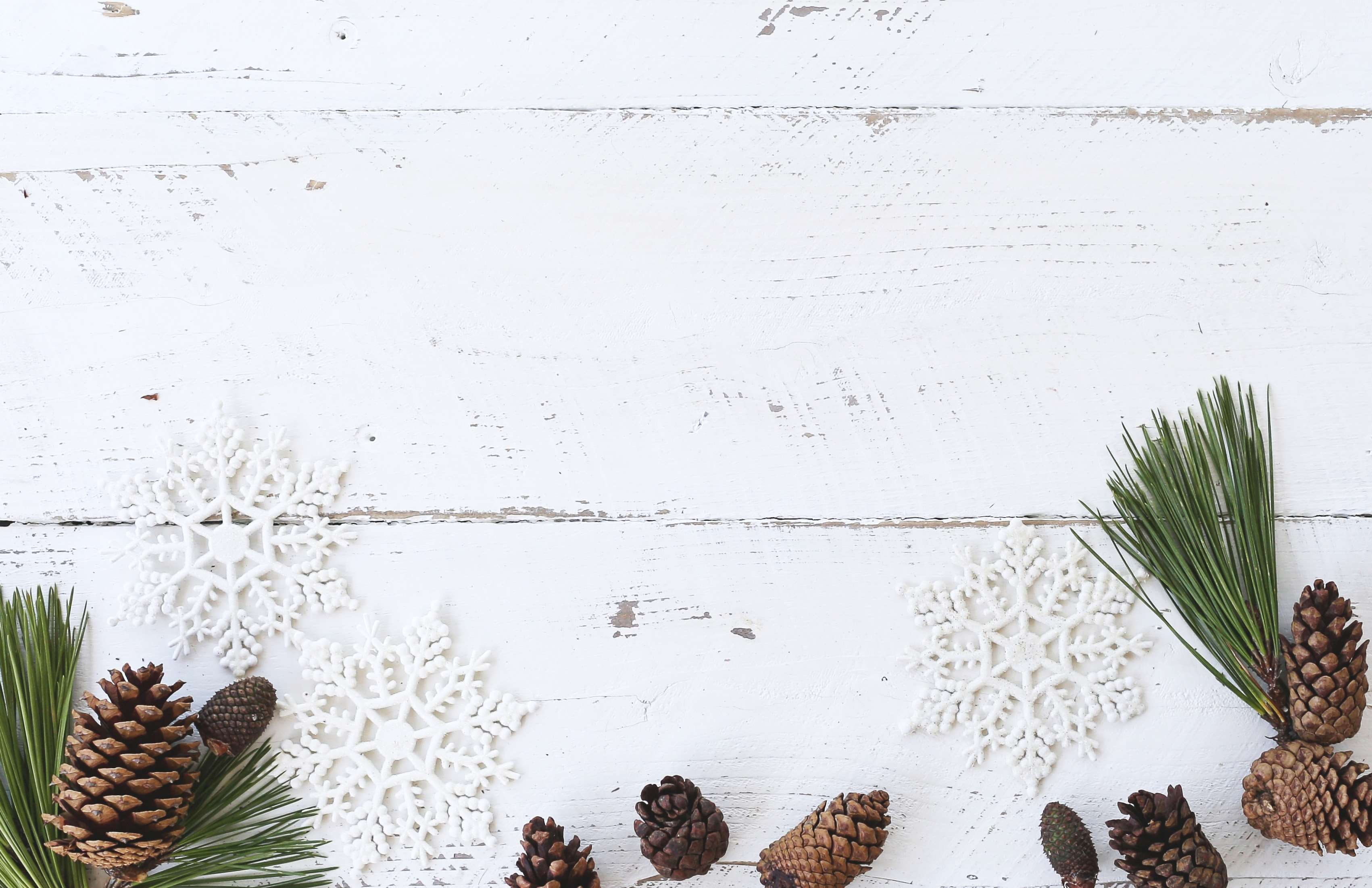 christmas desk flatlay holiday pine cone rustic white wood 2k