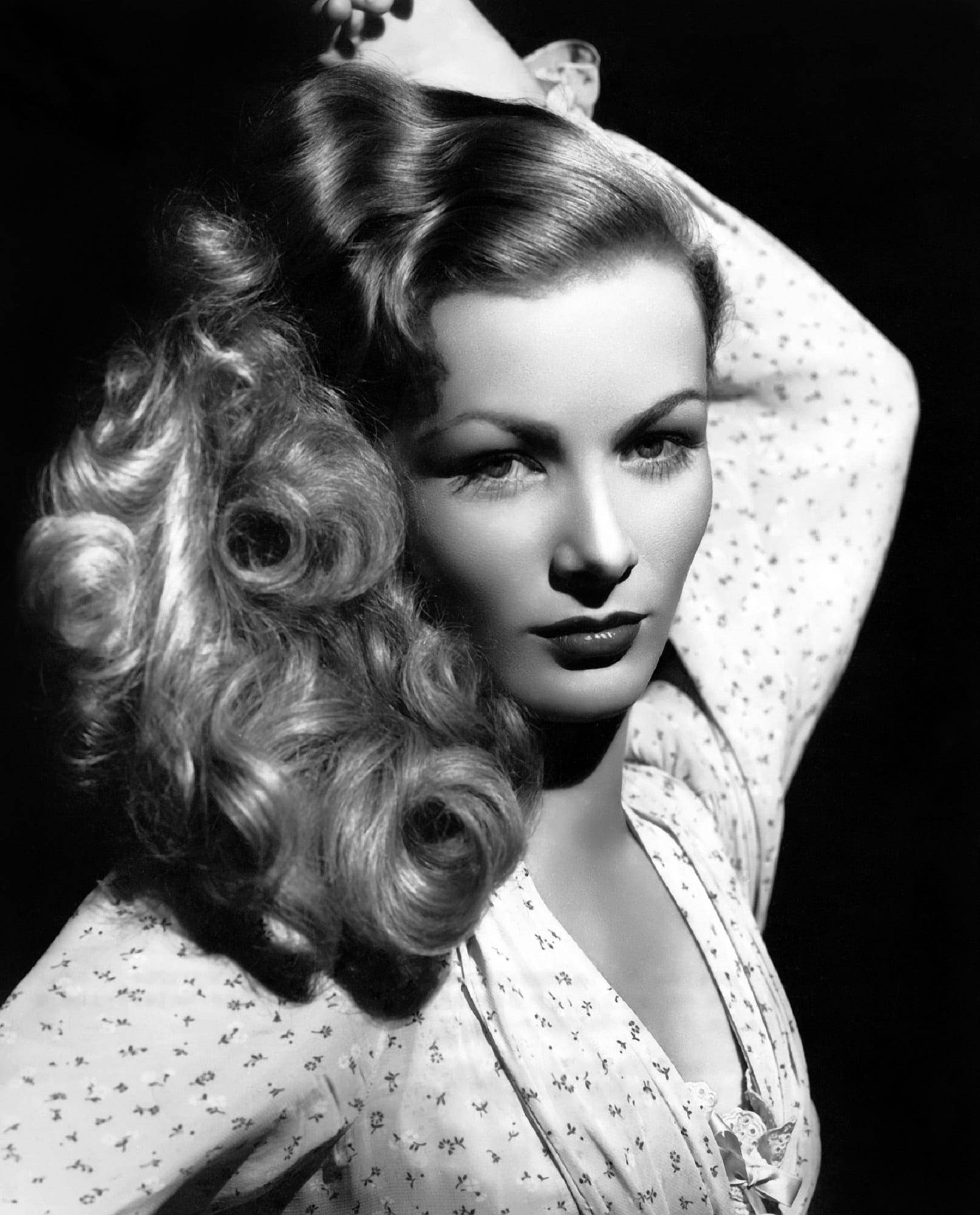 grayscale of woman raising her left hand veronica lake actress