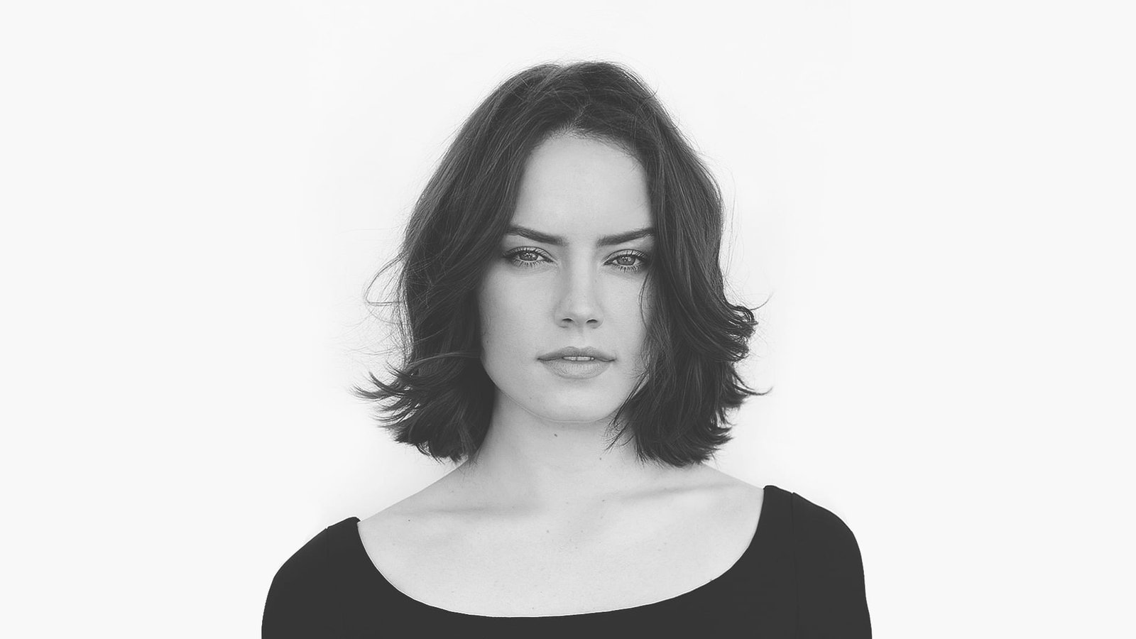 grayscale of woman scoop neck top face women Daisy Ridley