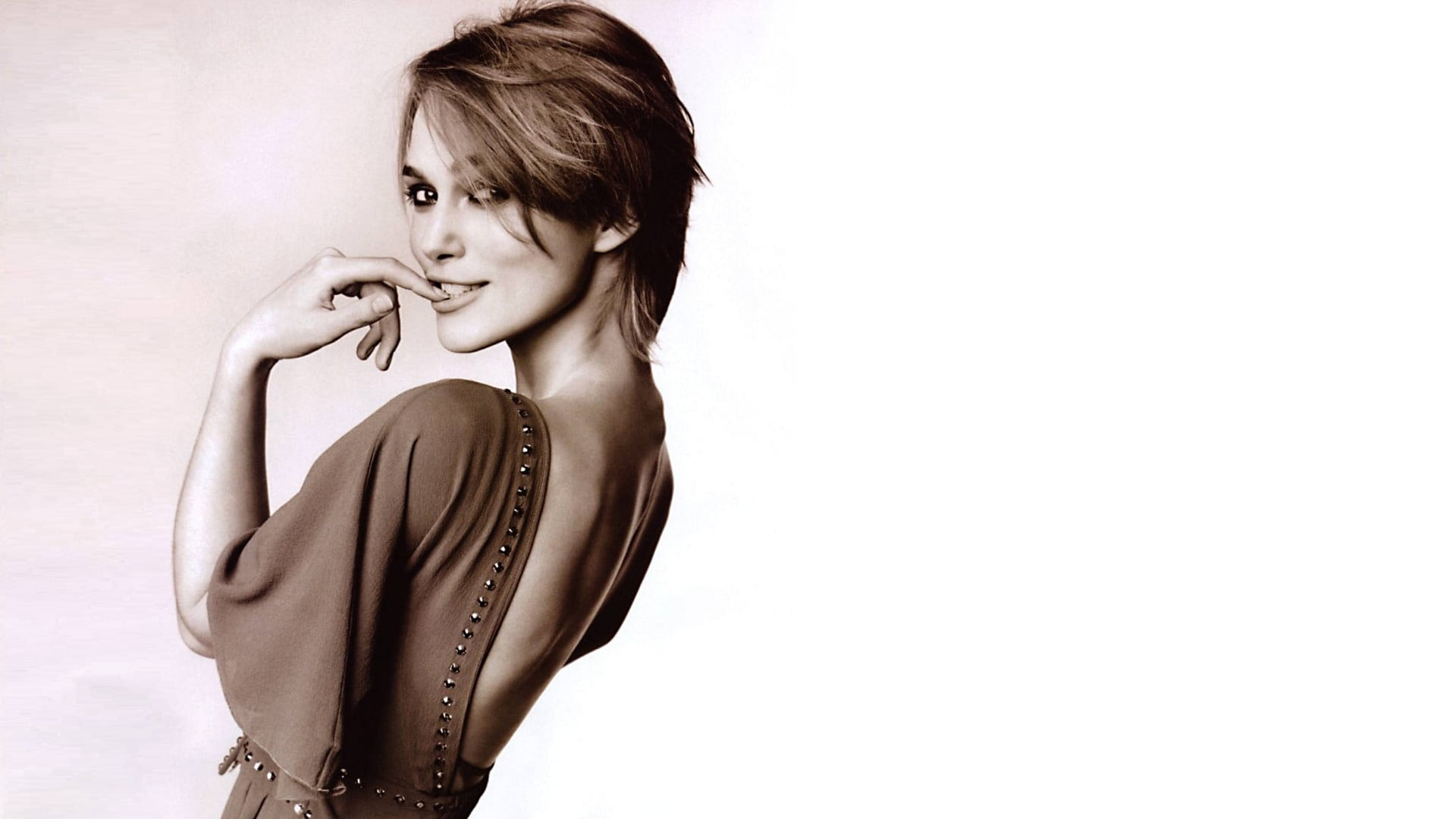 Keira Knightley brunette brown eyes back smiling sepia