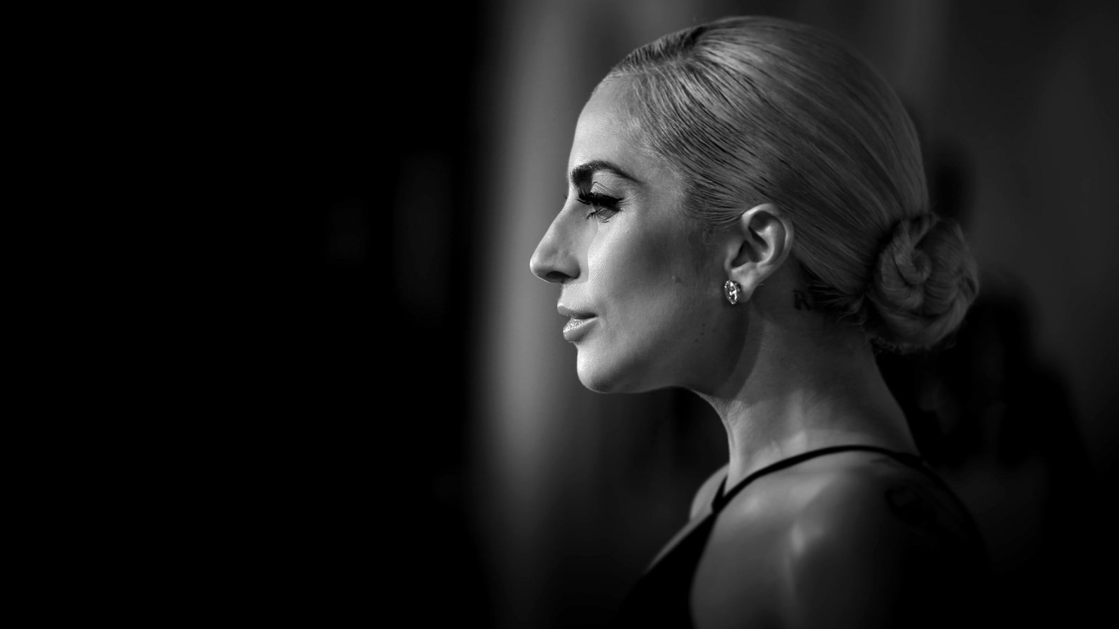 woman wearing black jacket holding bubble Lady Gaga Stefani Joanne Angelina Germanotta 2k
