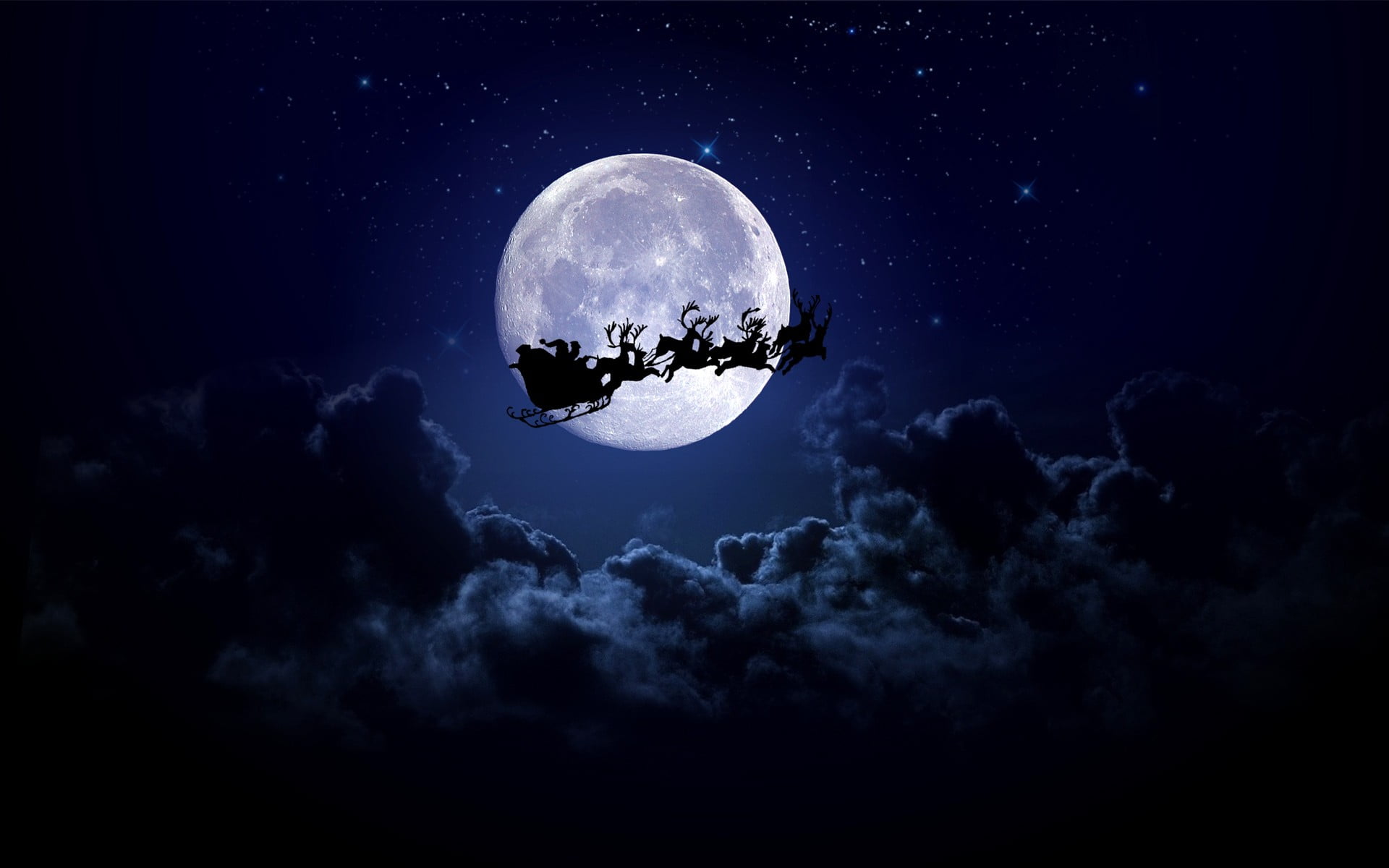 Santa Claus riding sleigh with reindeer wallpaper Christmas 2k