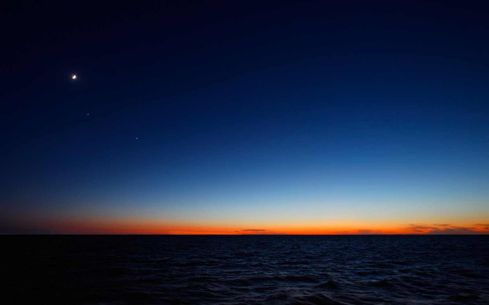 body of water during sunset sky sea nature horizon over 2k