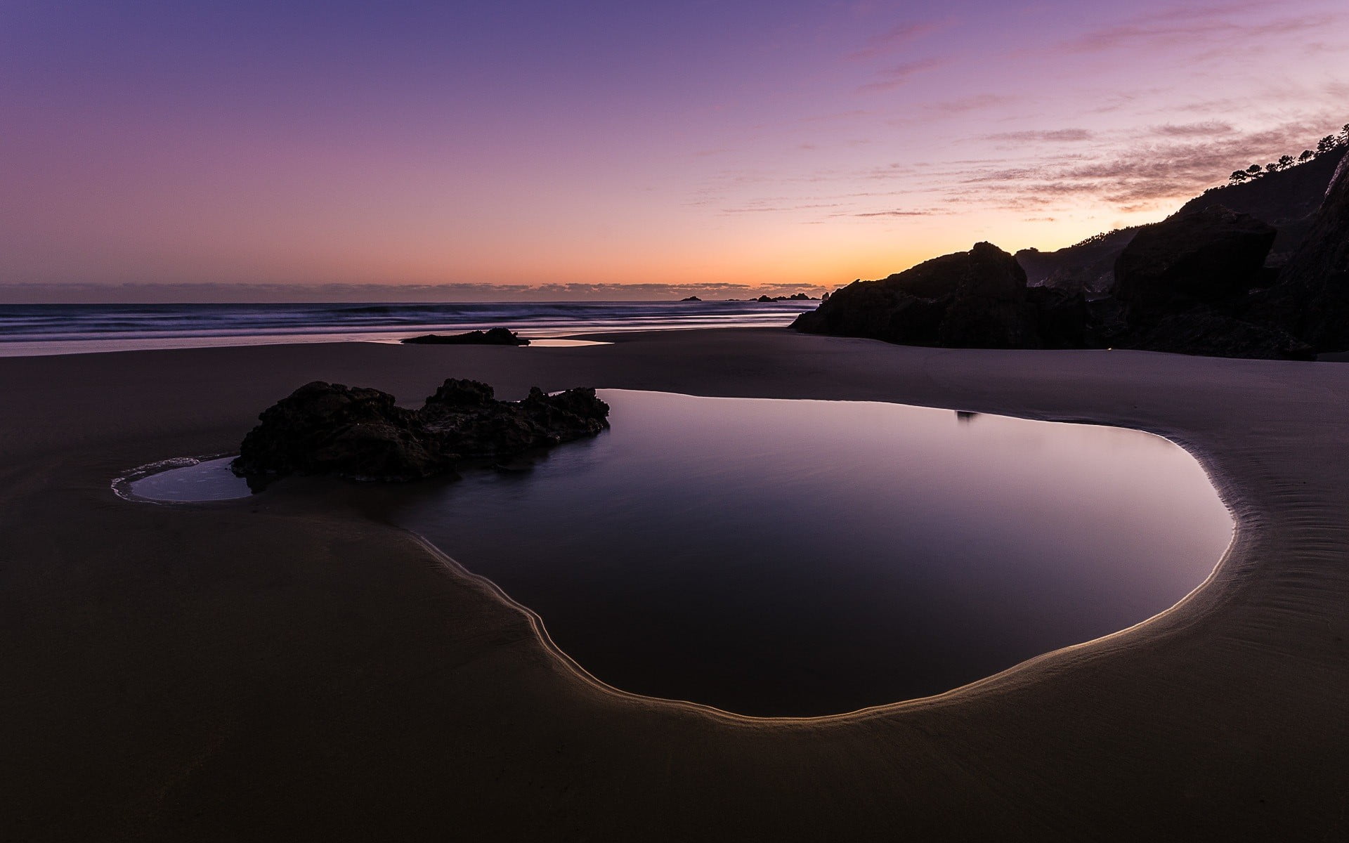 beach near mountain landscape rock water sand puddle sky 2k
