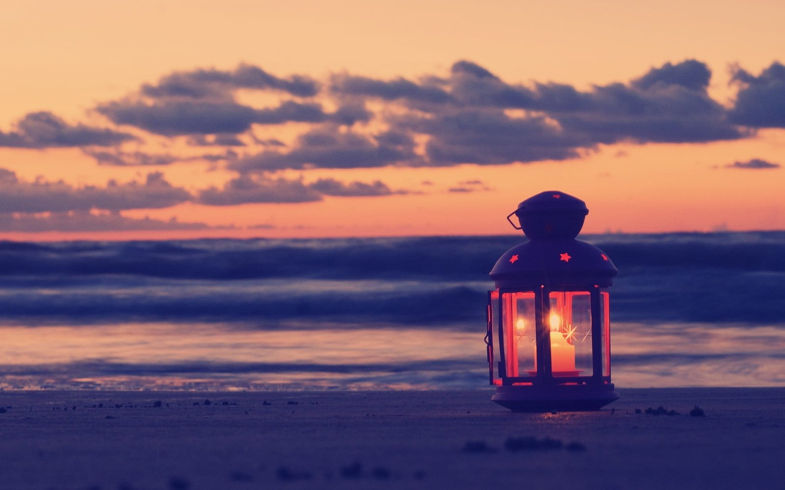 black candle sconce filter beach lantern sand clouds sunset 2k