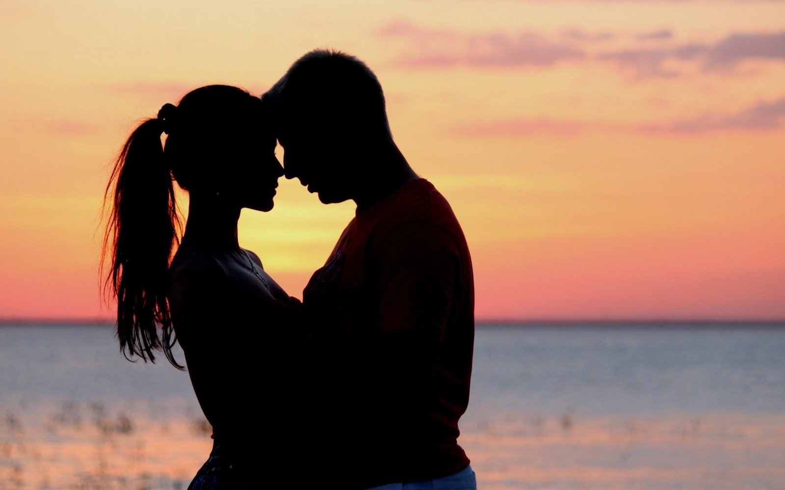 men's red top couple love sunset hugs beach togetherness 2k